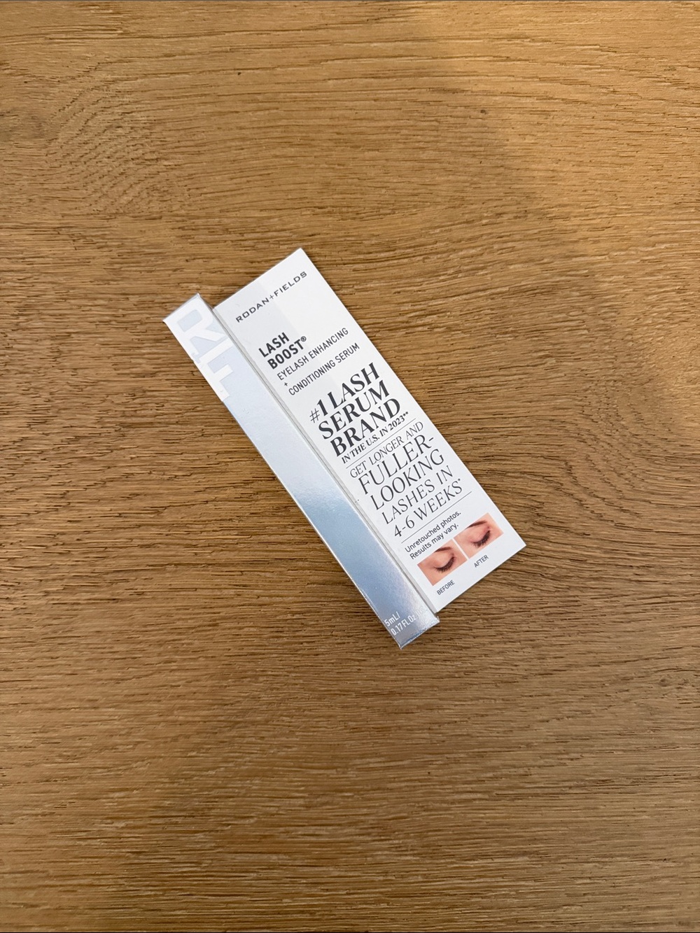 Rodan + Fields Lash Boost Serum in Silver and White Packaging
